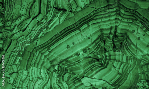 Malachite is a green mineral gemstone texture. Semiprecious ornamental stone malachite. green background