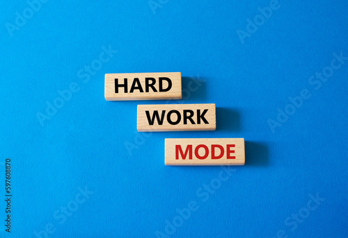 Hard Work Mode symbol. Concept word Hard Work Mode on wooden blocks. Beautiful blue background. Business and Hard Work Mode concept. Copy space