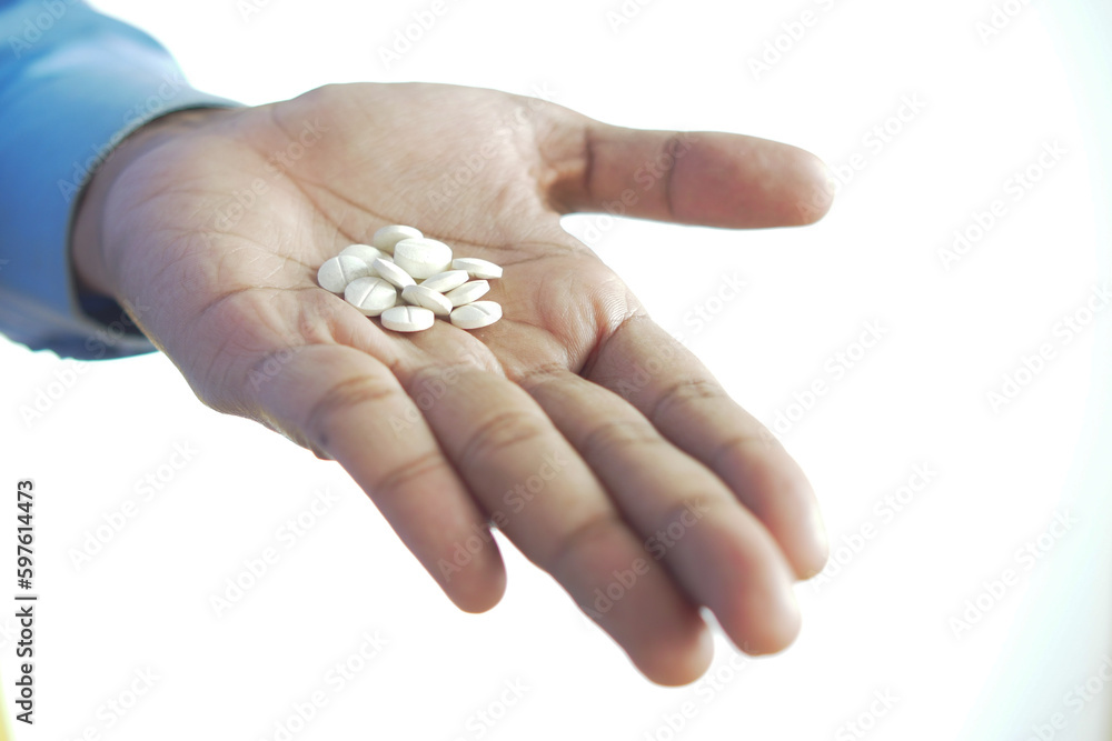 medical pills on hand isolated on white medical pills on hand isolated on white