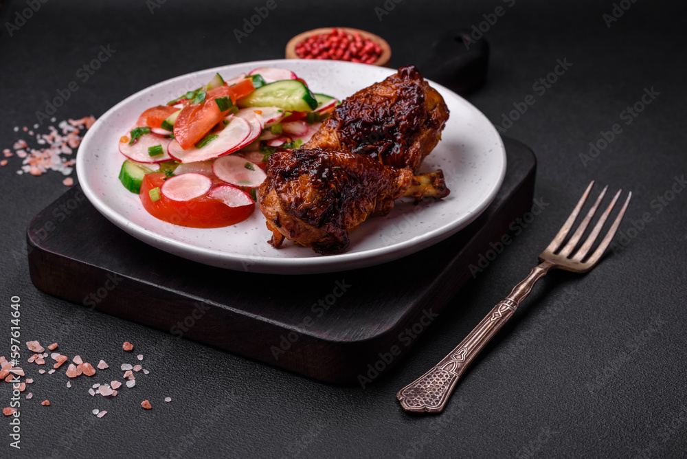 Delicious nutritious dish consisting of grilled chicken legs with a salad Delicious nutritious dish consisting of grilled chicken legs with a salad