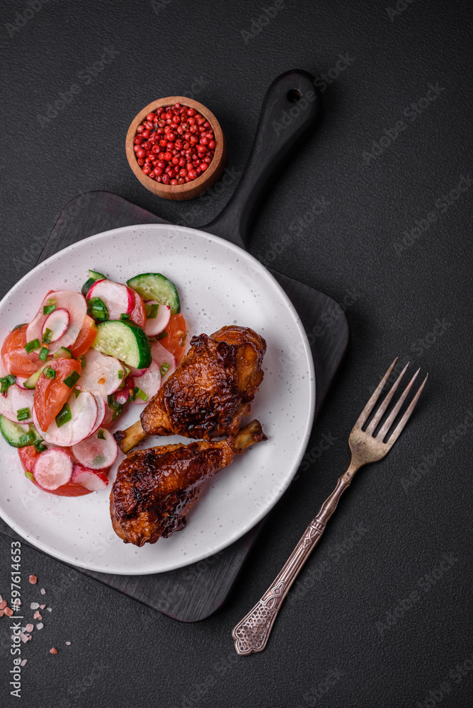 Delicious nutritious dish consisting of grilled chicken legs with a salad Delicious nutritious dish consisting of grilled chicken legs with a salad