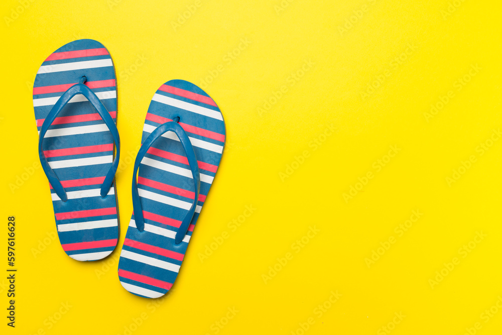 Bright flip flops on color background, top view Bright flip flops on color background, top view