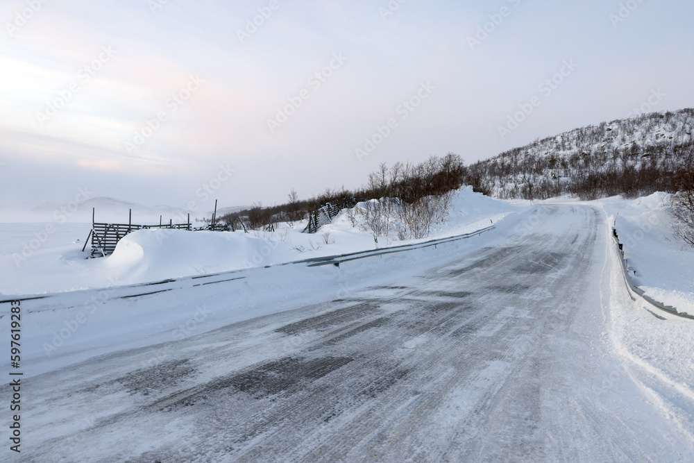 Stormy windy winter conditions on the road in Lapland, Enontekio, Finland, Europe