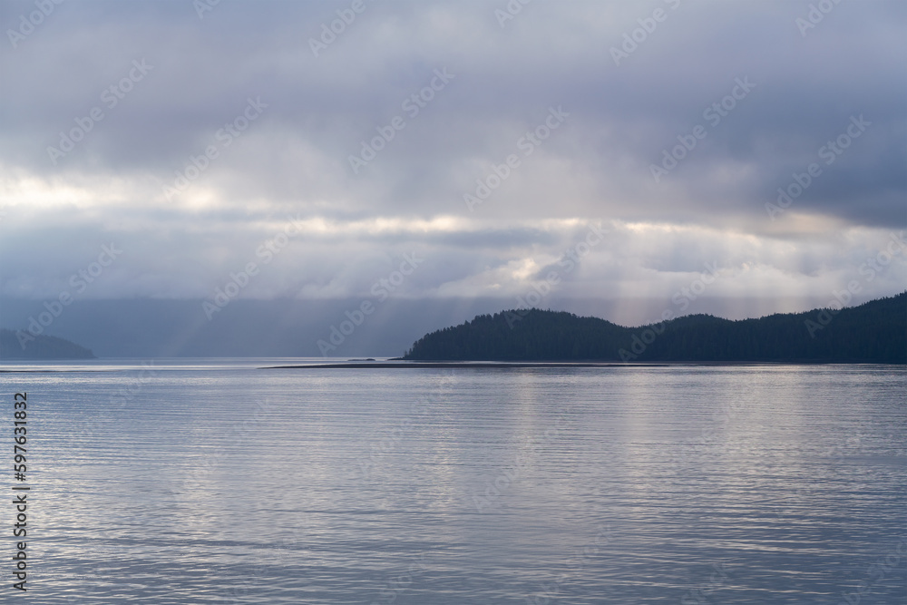 Sunbeam sunrise along islands of Inside Passage Cruise, British Columbia, Canada. Sunbeam sunrise along islands of Inside Passage Cruise, British Columbia, Canada.
