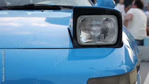 blue sport retro car with retractable headlights. sport car at the start.