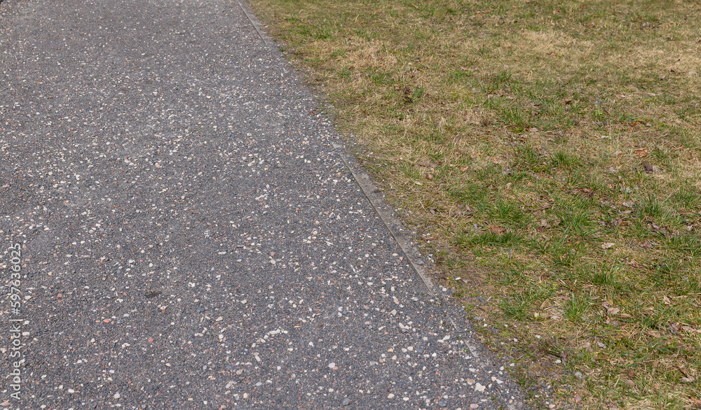 Obraz premium a gravel and stone-strewn walking path in the park