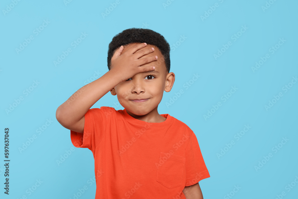 Portrait of emotional African-American boy on turquoise background Portrait of emotional African-American boy on turquoise background