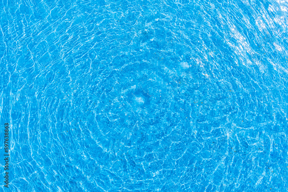 A serene photo capturing the perfect summer day with a vibrant swimming pool as the main focus, charmingly accompanied by a delightful duck enjoying a cool swim. A must-see for all nature and aquatic