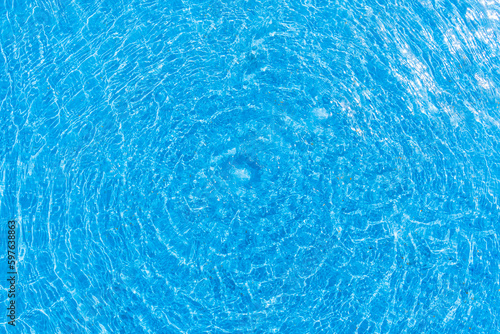 A serene photo capturing the perfect summer day with a vibrant swimming pool as the main focus, charmingly accompanied by a delightful duck enjoying a cool swim. A must-see for all nature and aquatic 