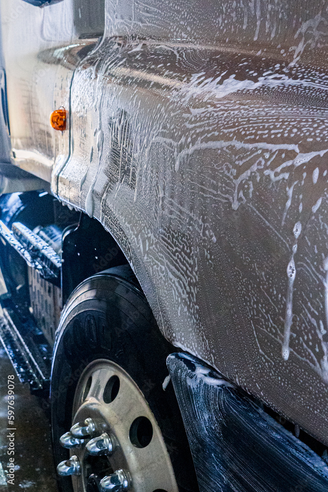A bustling truck maintenance shop, providing comprehensive truck wash services and expert repair solutions for both trucks and trailers.