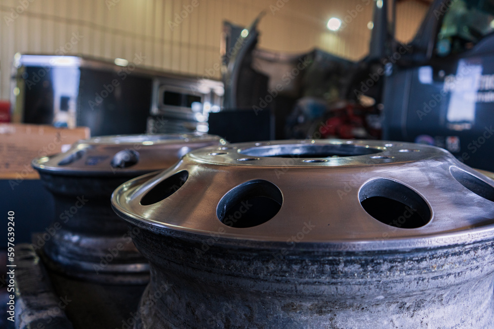 A bustling truck maintenance shop, providing comprehensive truck wash services and expert repair solutions for both trucks and trailers.