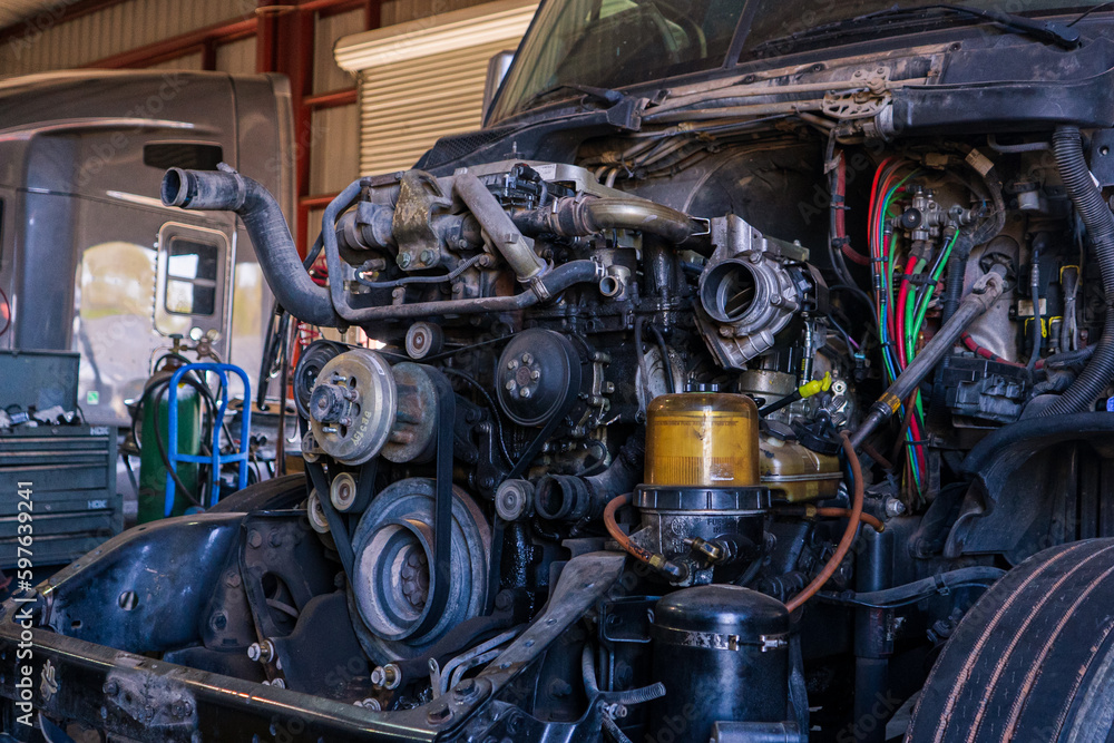 A bustling truck maintenance shop, providing comprehensive truck wash services and expert repair solutions for both trucks and trailers.
