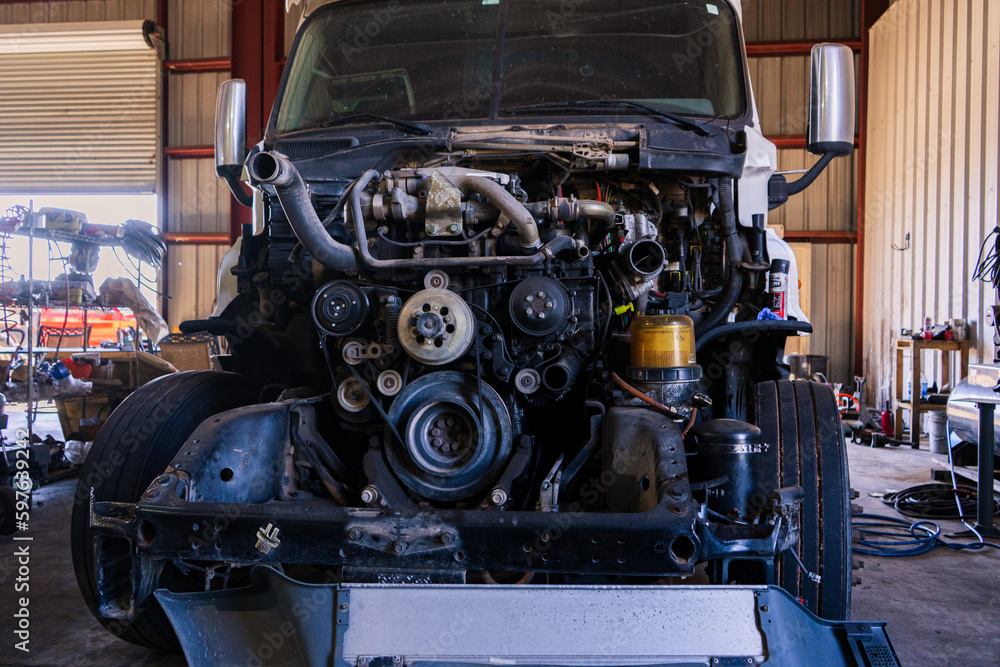 A bustling truck maintenance shop, providing comprehensive truck wash services and expert repair solutions for both trucks and trailers.