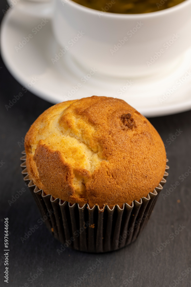 Soft and fresh fragrant wheat cupcake on a black stone Soft and fresh fragrant wheat cupcake on a black stone