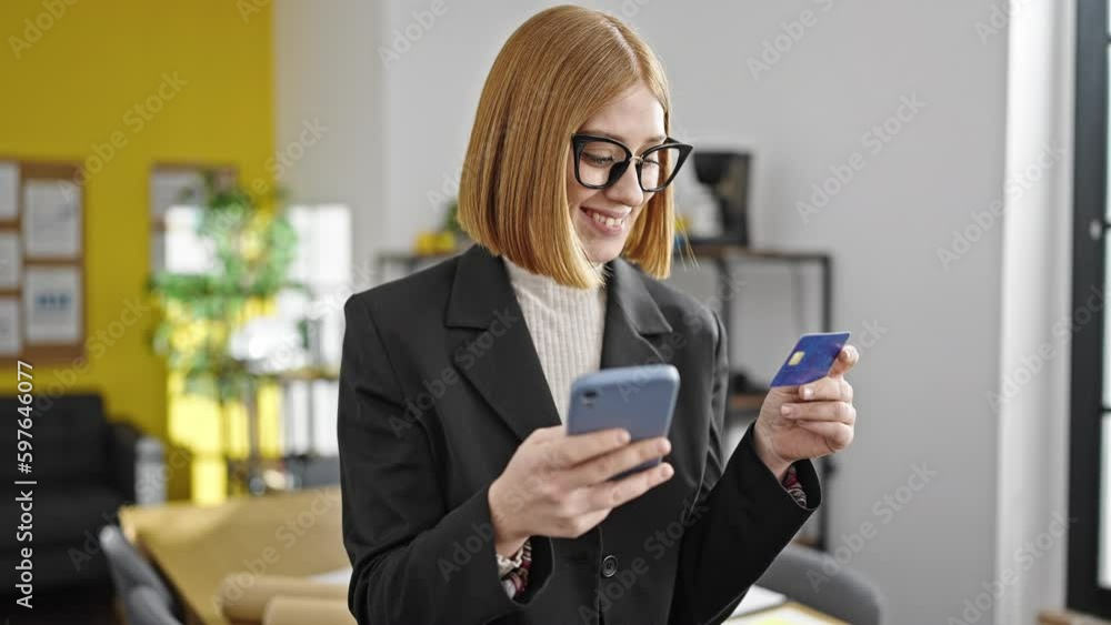 Young blonde woman business worker shopping with smartphone and credit card at office Young blonde woman business worker shopping with smartphone and credit card at office