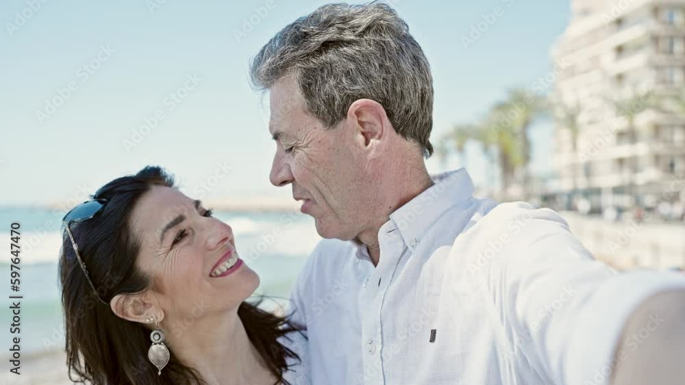 Senior man and woman couple smiling confident make selfie by camera at seaside Senior man and woman couple smiling confident make selfie by camera at seaside