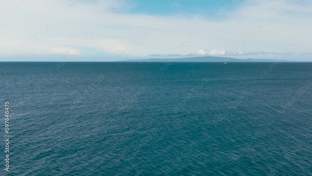 Flight over the sea. Blue sea and sky with clouds. Philippines. Flight over the sea. Blue sea and sky with clouds. Philippines.