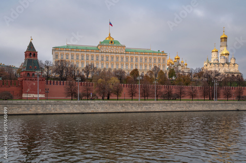 View of the building of the Grand Kremlin Palace, the Annunciation Tower and the ensemble of the Kremlin Cathedral Square from the embankment of the Moskva River, Moscow, Russia