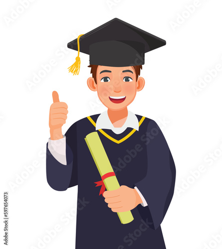Happy young graduate man in graduation gown and hat holding diploma and certificate showing thumb up