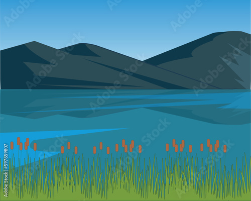 Colorful landscape lake in mountain and bulrush