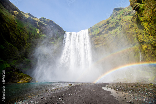 Fototapeta Naklejka Na Ścianę i Meble -  Thunderous Beauty: A Mesmerizing View of Skógafoss Waterfall in Iceland
