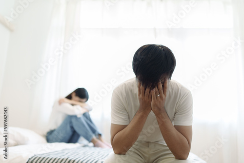 Photos Young couple lying in bed in bedroom at home, woman in lingerie sleeping, sad, frustrated man thinking about relationships, family having sexual problems, erectile dysfunction concepts