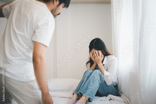 Domestic violence and Family conflict concept  father fighting mother with quarrel at home.