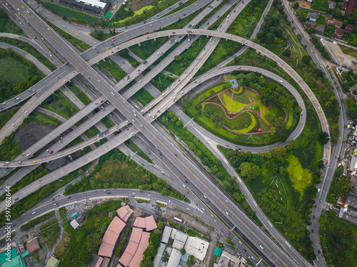 Aerial view city transport junction road with green tree forest park