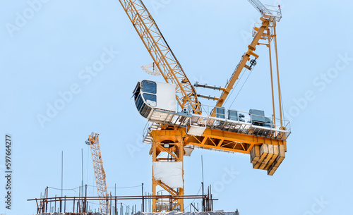 Wallpaper Mural Tower construction crane in rooftop building construction site with blue sky background Torontodigital.ca