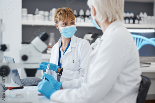 Talking  science woman and in laboratory for research  investigation or collaboration. Expert scientist team in a medical lab with a face mask for innovation  future medicine or biotechnology study