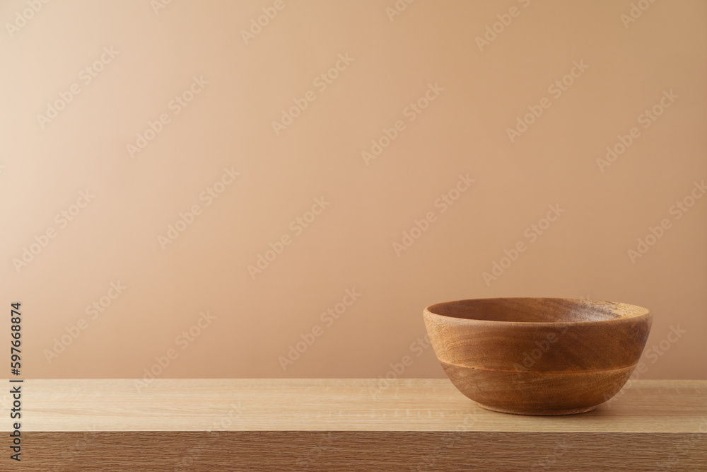 Empty wooden bowl on table over modern  background. Kitchen mock up for design and product display