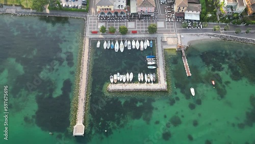 Overhead View Of Boats In The Port of Cisano In Lake Garda, Italy. - aerial photo