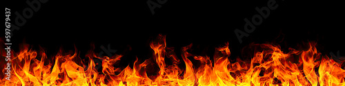 Fire flames on black background. fire isolated over black background. Texture of fire on black background. Abstract fire flame background, large burning fire photo