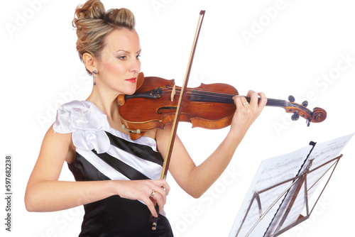 Art, woman playing violin in studio with sheet music, professional orchestra musician on white background. Focus, talent and classical performance, concert violinist with instrument in black dress.