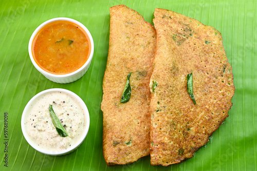 Adai dosa breakfast on banana leaf. photo