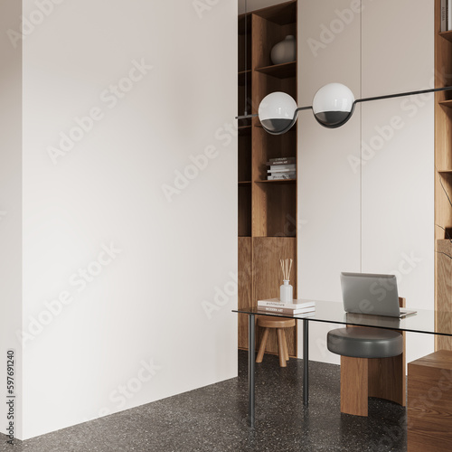 Obraz na płótnie Stylish workplace interior with laptop on desk and shelf, mockup wall