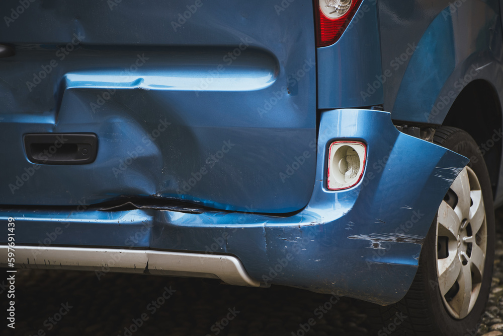 A car with a dented bumper has been damaged in road accident