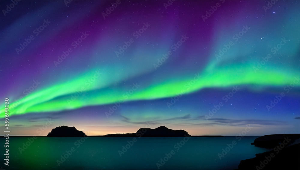Night sky with aurora borealis over sea and silhouette of hills on horizon