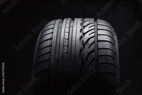 Summer Car tires with snow on black background