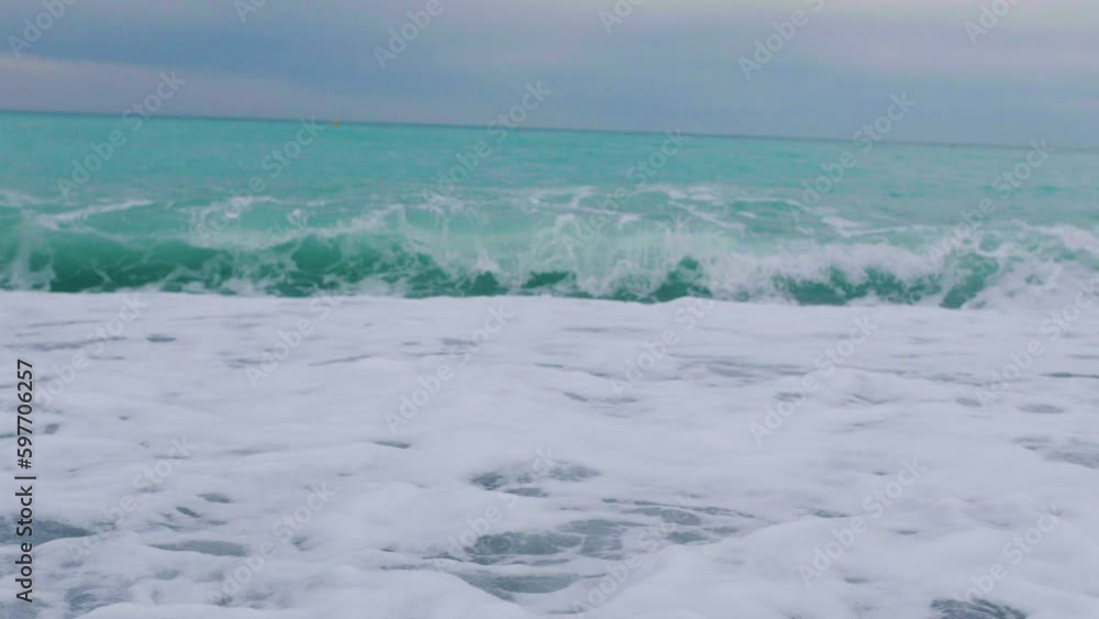 Foamy sea waves, rough sea, rocky coastline, vacation concept Foamy sea waves, rough sea, rocky coastline, vacation concept
