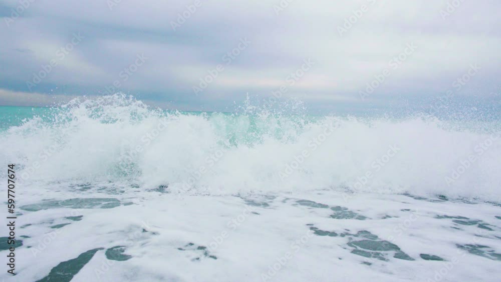 Foamy sea waves, rough sea, rocky coastline, vacation concept Foamy sea waves, rough sea, rocky coastline, vacation concept
