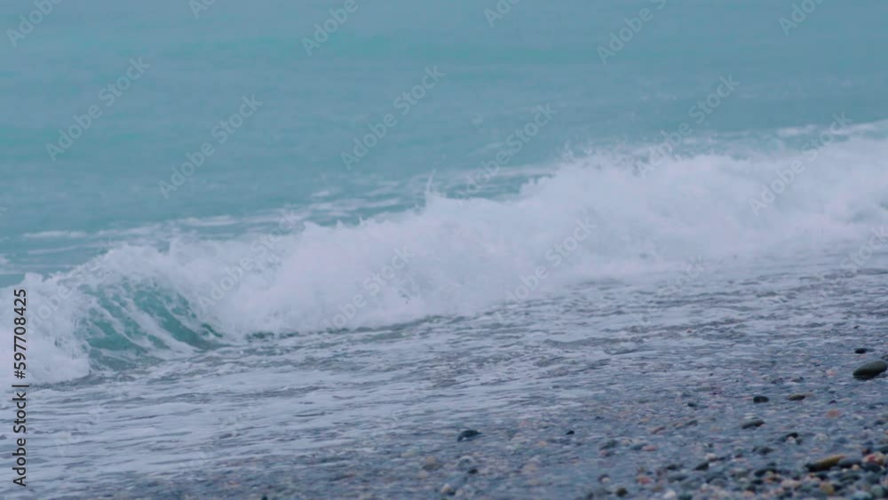 Foamy sea waves, rough sea, rocky coastline, vacation concept Foamy sea waves, rough sea, rocky coastline, vacation concept