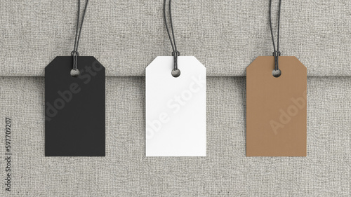 White, cardboard, black tags mockup on fabric background. View directly above