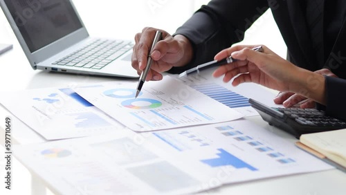 Meeting business people are analyzing business finance and investment charts and discussing the company's marketing growth strategy. Accounting and Financial Planning photo