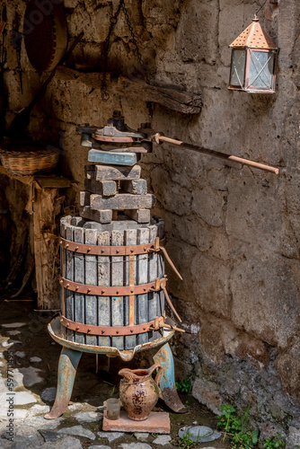 An ancient wooden grape press in the ghost town of Celleno, Italy