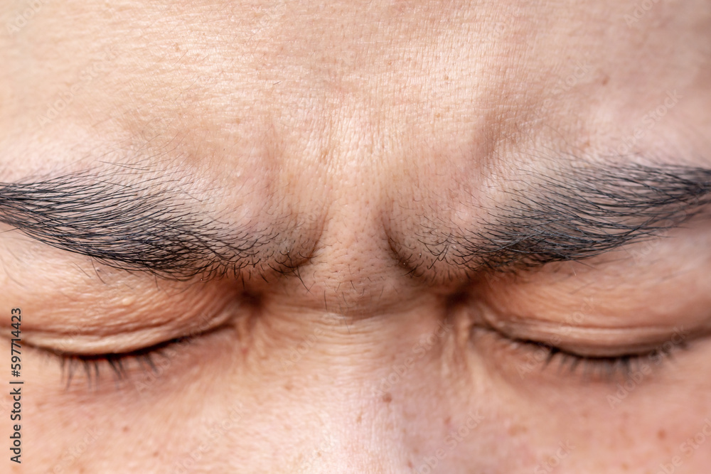 The eyebrows of a person who is stressed The eyebrows of a person who is stressed