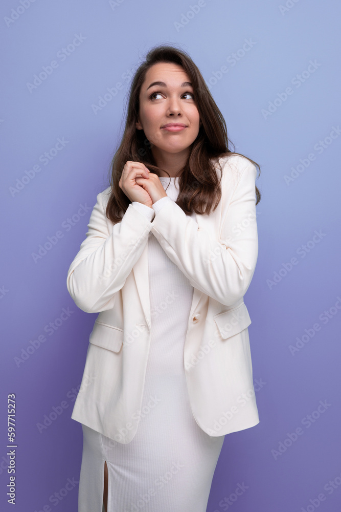 portrait of a well-groomed caucasian brunette woman in a white dress portrait of a well-groomed caucasian brunette woman in a white dress