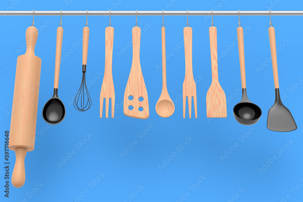 Set of kitchen utensil for preparation of dough hanging on shelf on blue Set of kitchen utensil for preparation of dough hanging on shelf on blue