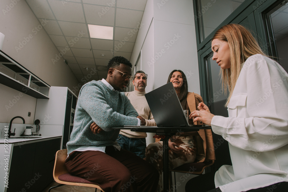 Obraz premium Different age of multiracial people working together at the office. Low angle view