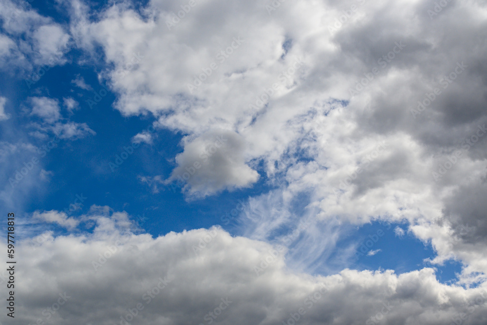 spring blue sky with clouds before dodge as background spring blue sky with clouds before dodge as background